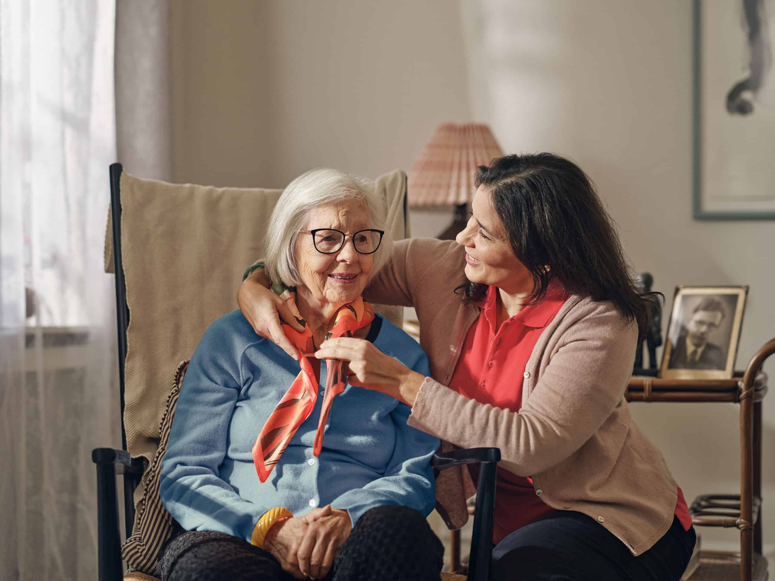Dovida caregiver helping elderly woman